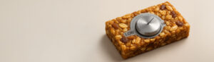 A granola bar with a knob for adjusting sweetness level
