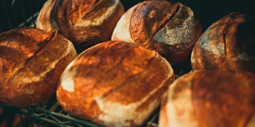 Freshly baked artisan sourdough loaves cooling on a wire rack
